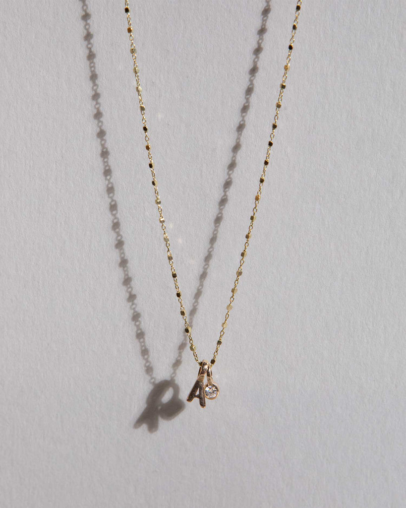 Recycled 9ct solid gold chain with initial charm and lab-grown diamond charm handmade in London by Maya Magal London