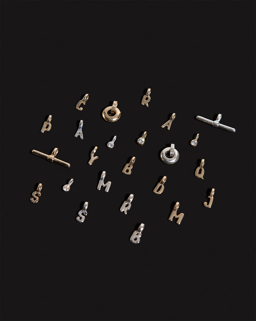 Recycled 9ct solid gold and 925 sterling silver charms handmade in London by Maya Magal London