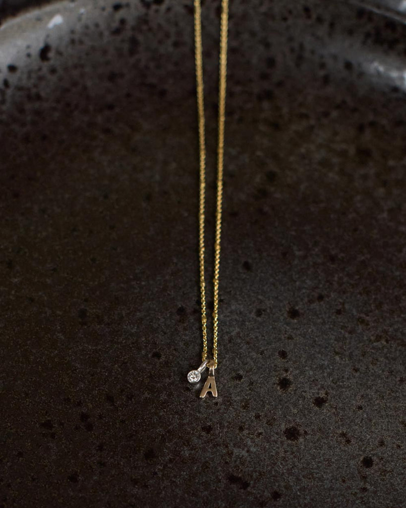 Recycled 9ct solid gold chain with initial charm and lab-grown diamond charm handmade in London by Maya Magal London