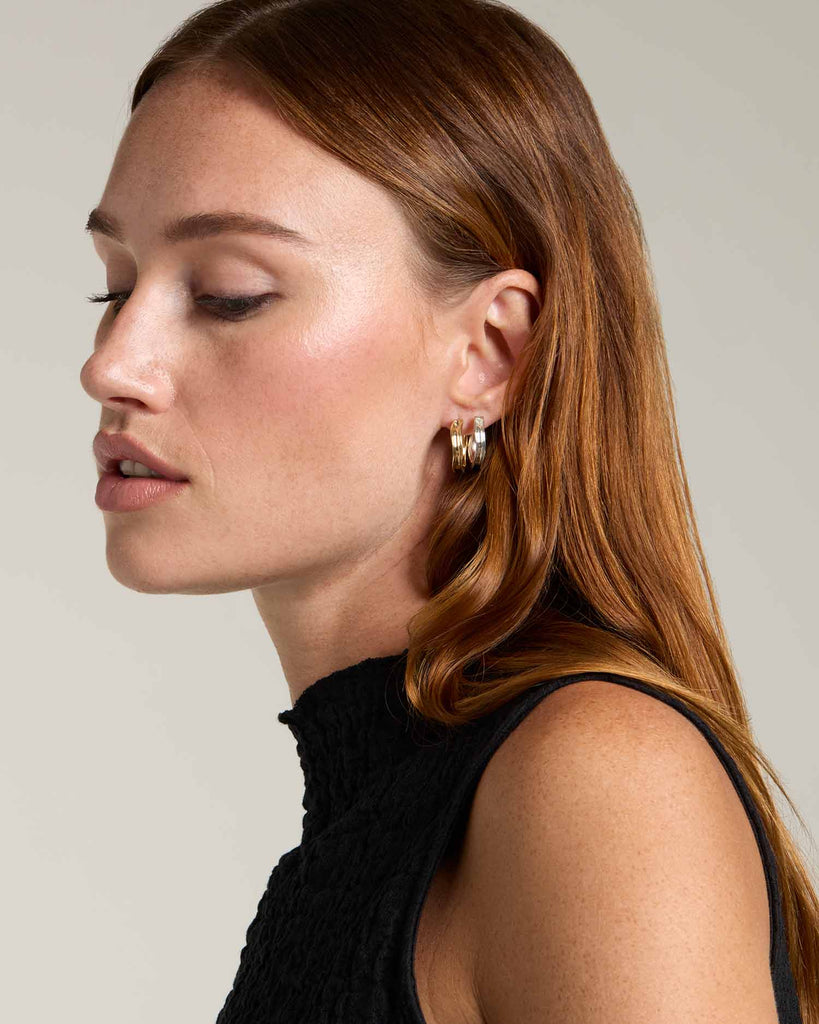 Recycled solid gold concave hoop earrings handcrafted in London by Maya Magal London