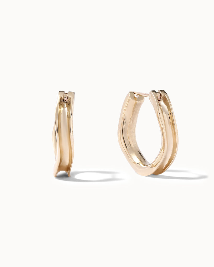 Recycled solid gold concave hoop earrings handcrafted in London by Maya Magal London