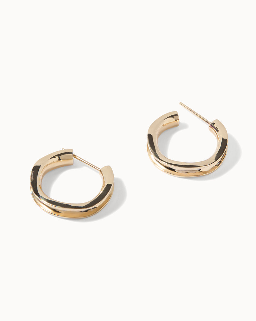 Recycled solid gold concave hoop earrings handcrafted in London by Maya Magal London