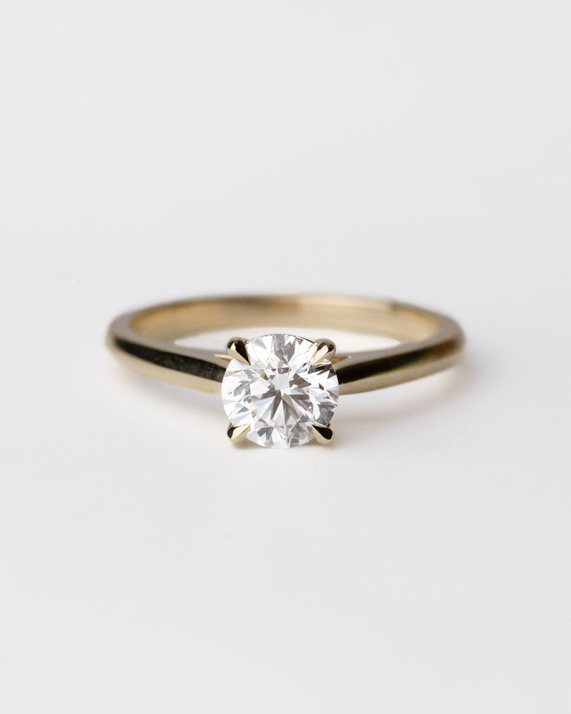 Solitaire engagement ring with brilliant cut lab grown diamond set on a recycled 9ct solid gold band handcrafted in London by Maya Magal London