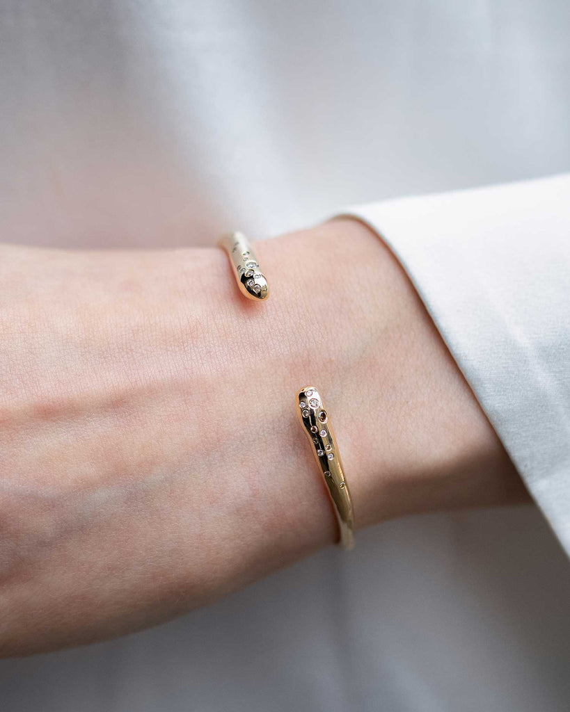 hand-carved recycled 9ct solid yellow gold bangle with finely set white and champagne natural diamonds handcrafted in London by Maya Magal London