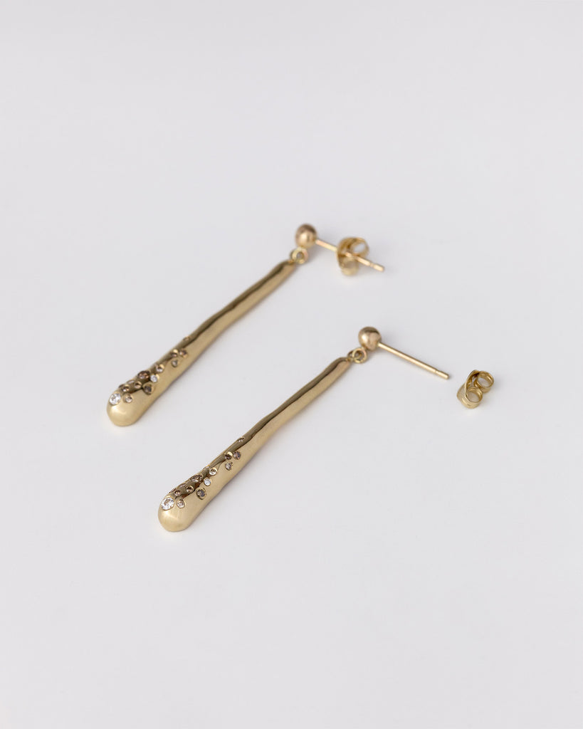 hand-carved recycled 9ct solid yellow gold drop earrings with finely set white and champagne natural diamonds handcrafted in London by Maya Magal London