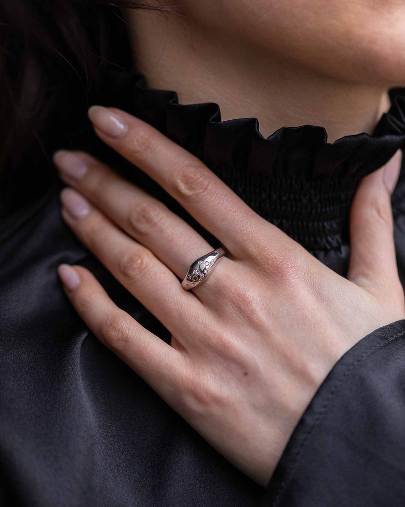 Recycled 9ct solid white gold sculptural signet ring with finely set white and champagne natural diamonds handcrafted in London by Maya Magal London