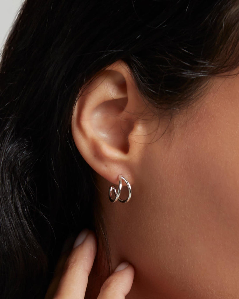 Recycled 925 sterling silver huggie hoop earrings handcrafted in London by Maya Magal London