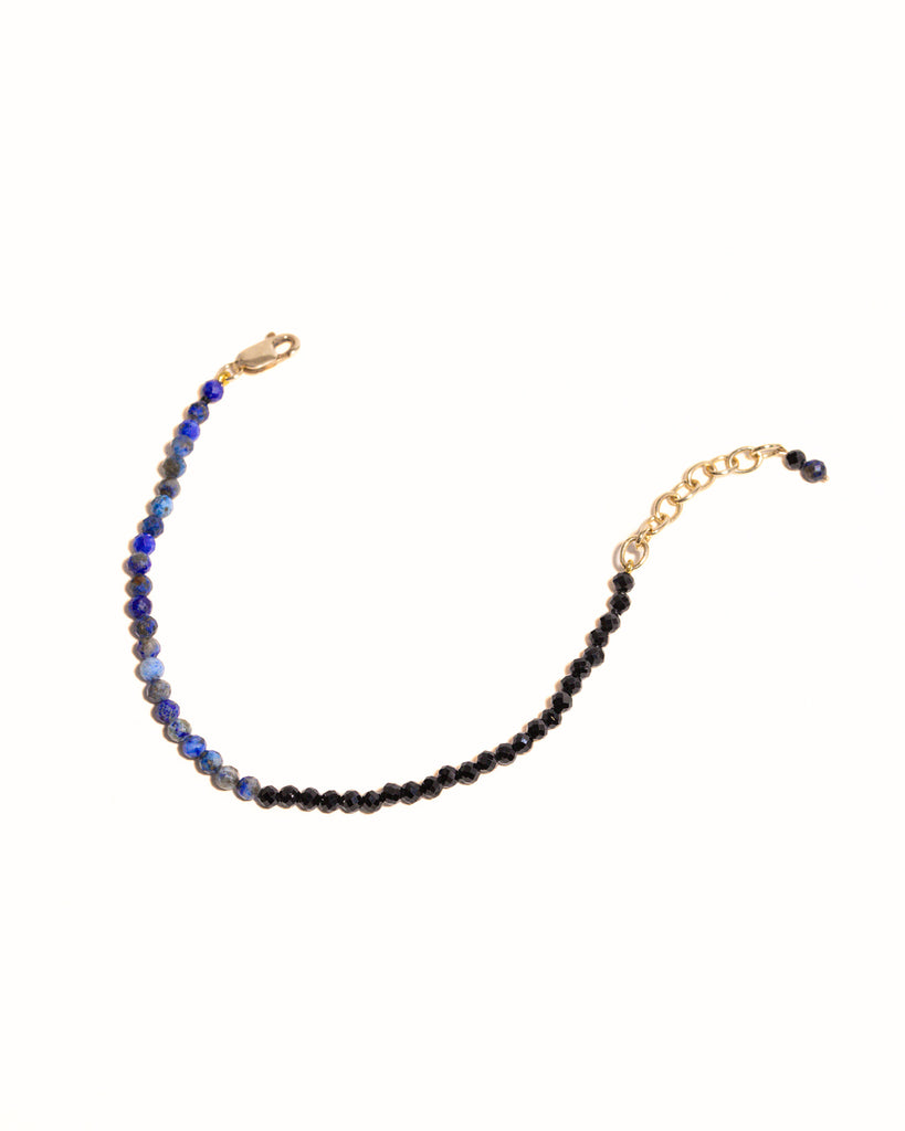 Blue lapis and black spinnel beaded bracelet handstrung on silk thread handcrafted in London with 9ct solid gold by Maya Magal London