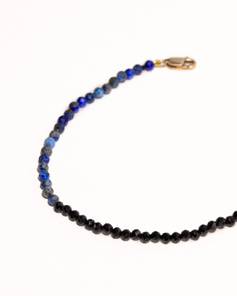 Blue lapis and black spinnel beaded bracelet handstrung on silk thread handcrafted in London with 9ct solid gold by Maya Magal London