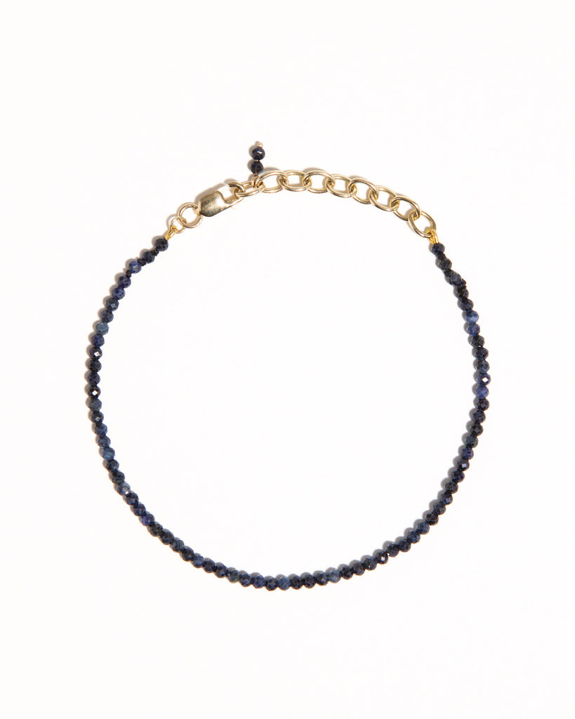 Blue sapphire beaded bracelet handstrung on silk thread handcrafted in London with 9ct solid gold by Maya Magal London