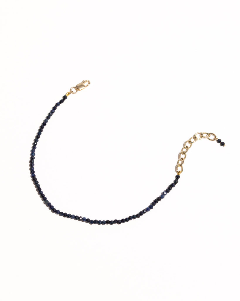 Blue sapphire beaded bracelet handstrung on silk thread handcrafted in London with 9ct solid gold by Maya Magal London