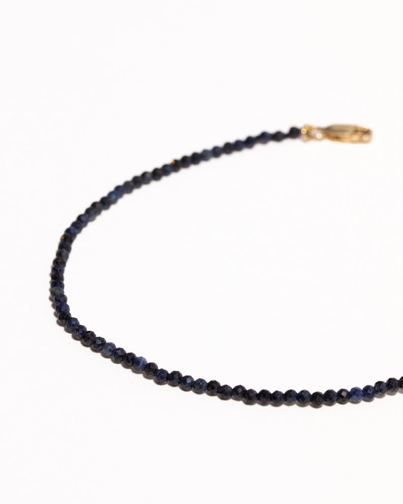 Blue sapphire beaded bracelet handstrung on silk thread handcrafted in London with 9ct solid gold by Maya Magal London