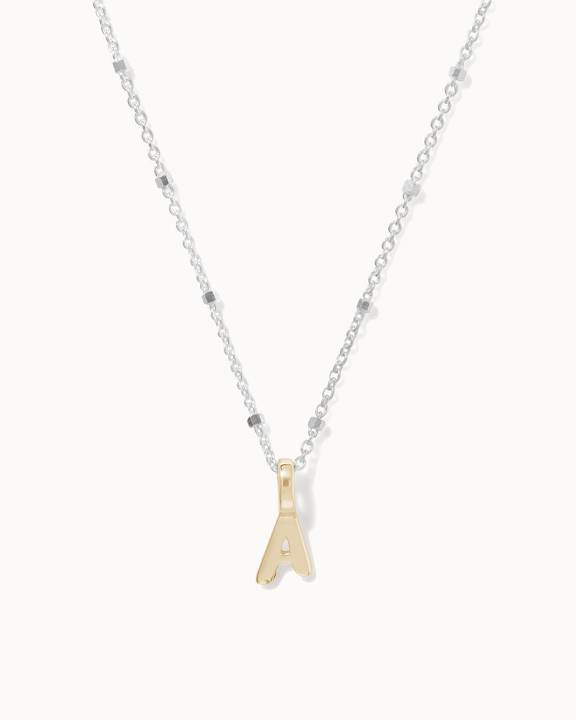 Recycled 925 sterling silver chain with 9ct solid gold initial charm handmade in London by Maya Magal London