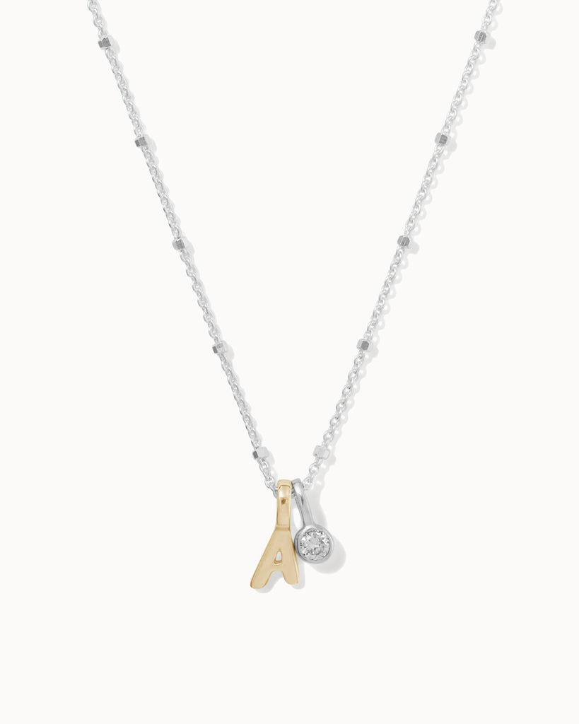 Recycled 925 sterling silver chain with 9ct solid gold initial charm and sterling silver lab-grown diamond charm handmade in London by Maya Magal London