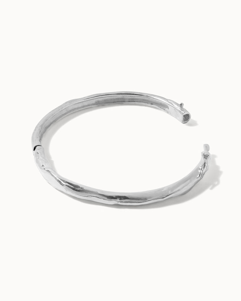 Recycled 925 sterling silver molten hinged bangle handcrafted in London by Maya Magal London