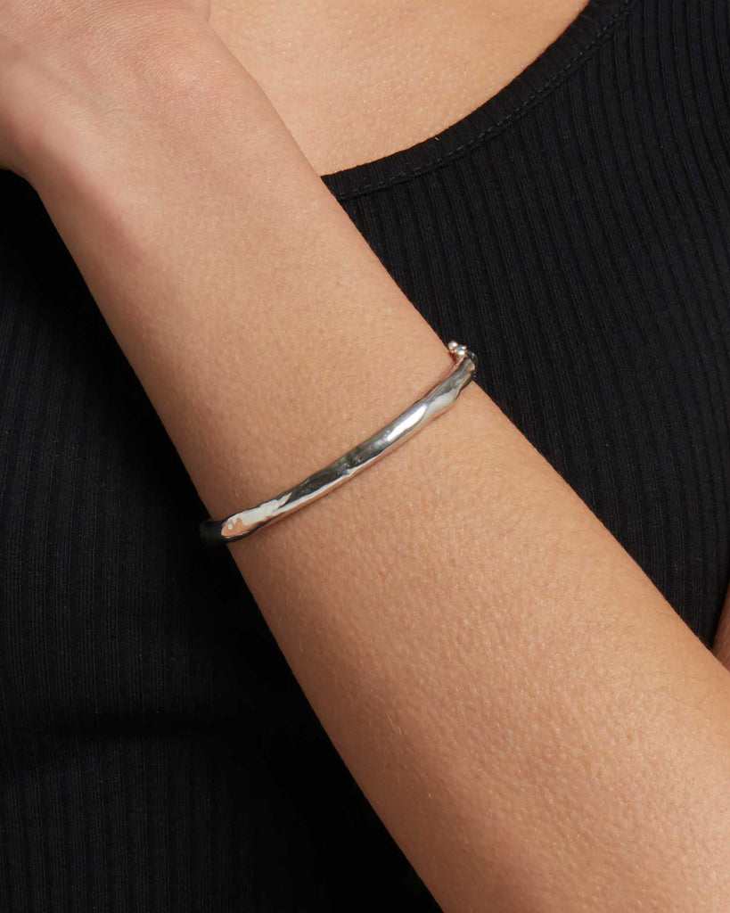 Recycled 925 sterling silver molten hinged bangle handcrafted in London by Maya Magal London