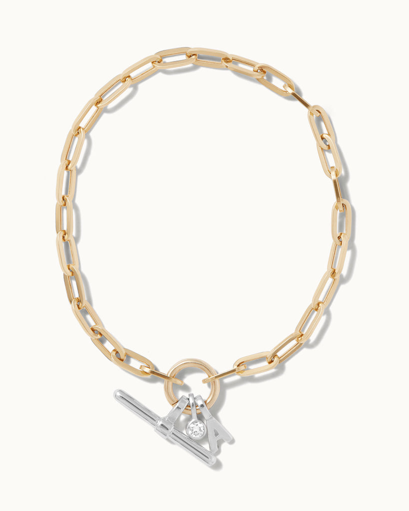 Recycled 9ct solid gold chain bracelet with 925 sterling silver t-bar charm, initial charm and lab-grown diamond charm handmade in London by Maya Magal London