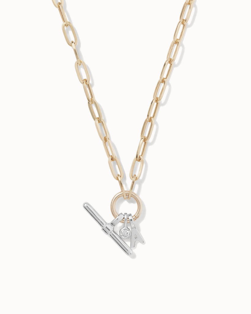 Recycled 9ct solid gold chain necklace with 925 sterling silver t-bar charm, initial charm and lab-grown diamond charm handmade in London by Maya Magal London