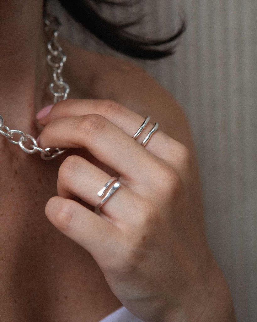 Sculptural adjustable ring in sterling silver with hammered finish handcrafted in London by Maya Magal London