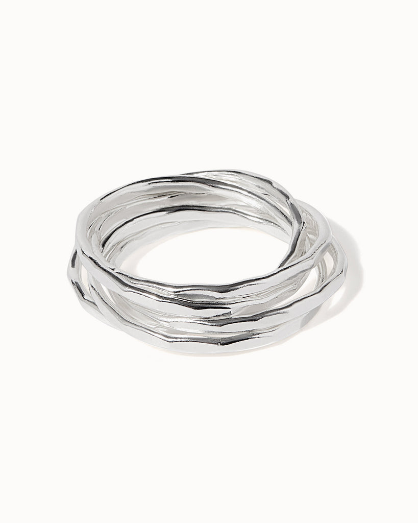 sterling silver interlocking rings with hammered texture handcrafted in London by Maya Magal London