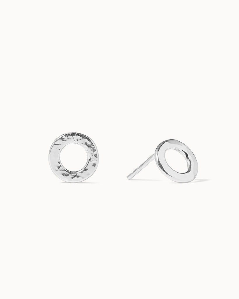 Statement sterling silver circular small stud earrings with hammered texture handcrafted in London by Maya Magal London