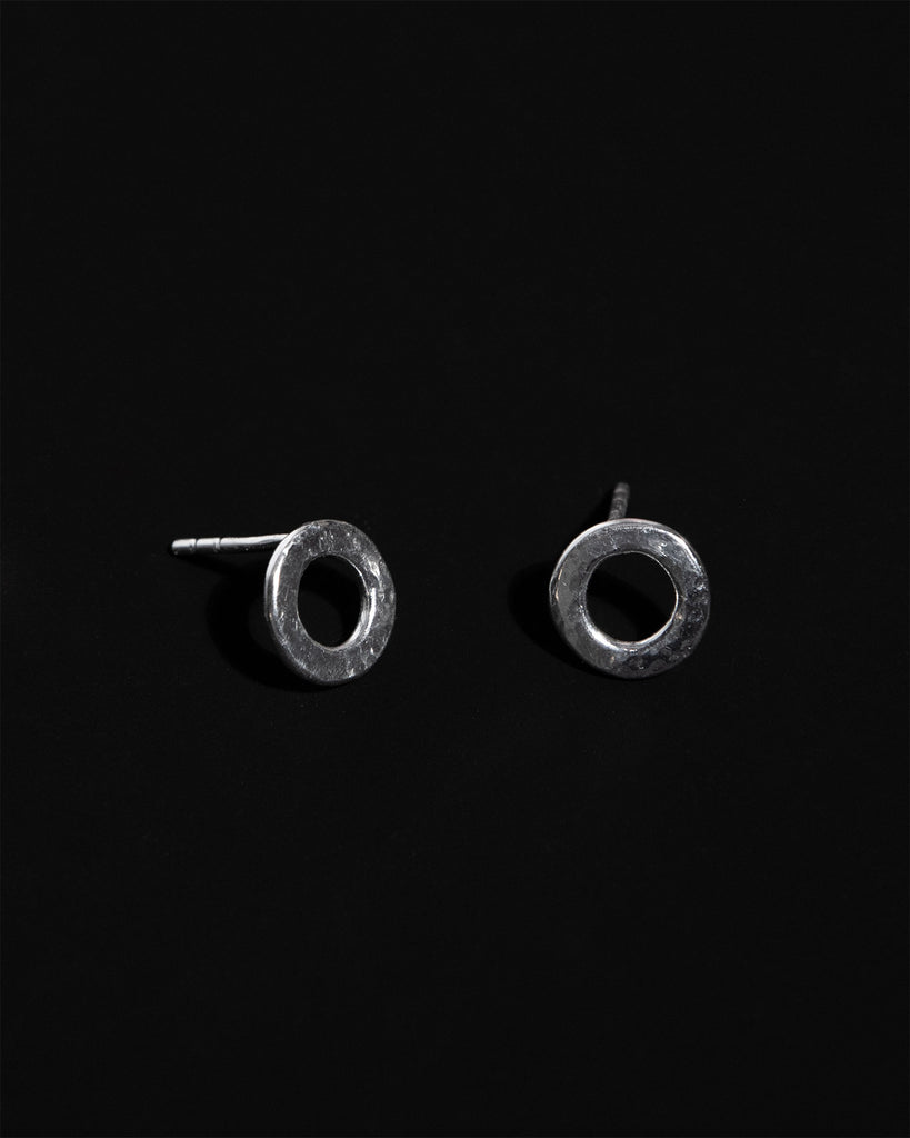 Statement sterling silver circular small stud earrings with hammered texture handcrafted in London by Maya Magal London