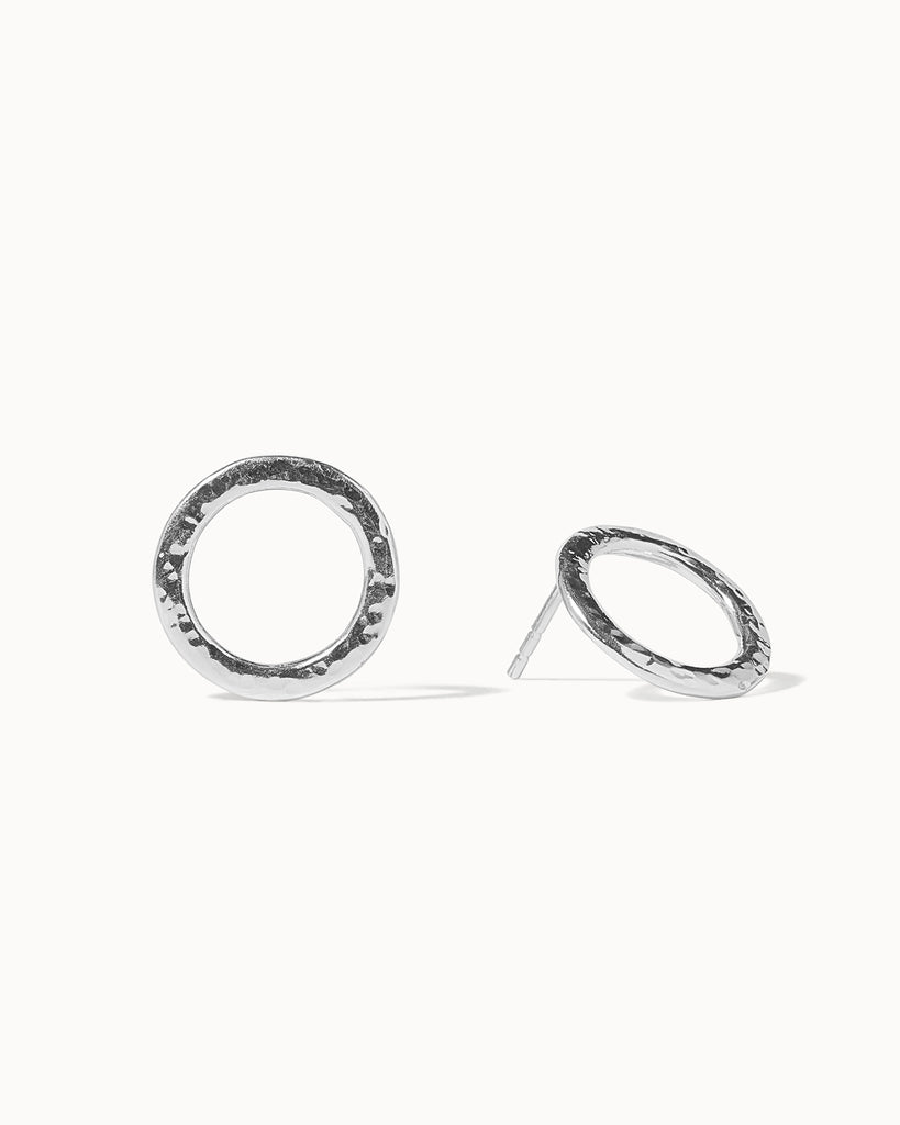 Statement sterling silver circular stud earrings with hammered texture handcrafted in London by Maya Magal London