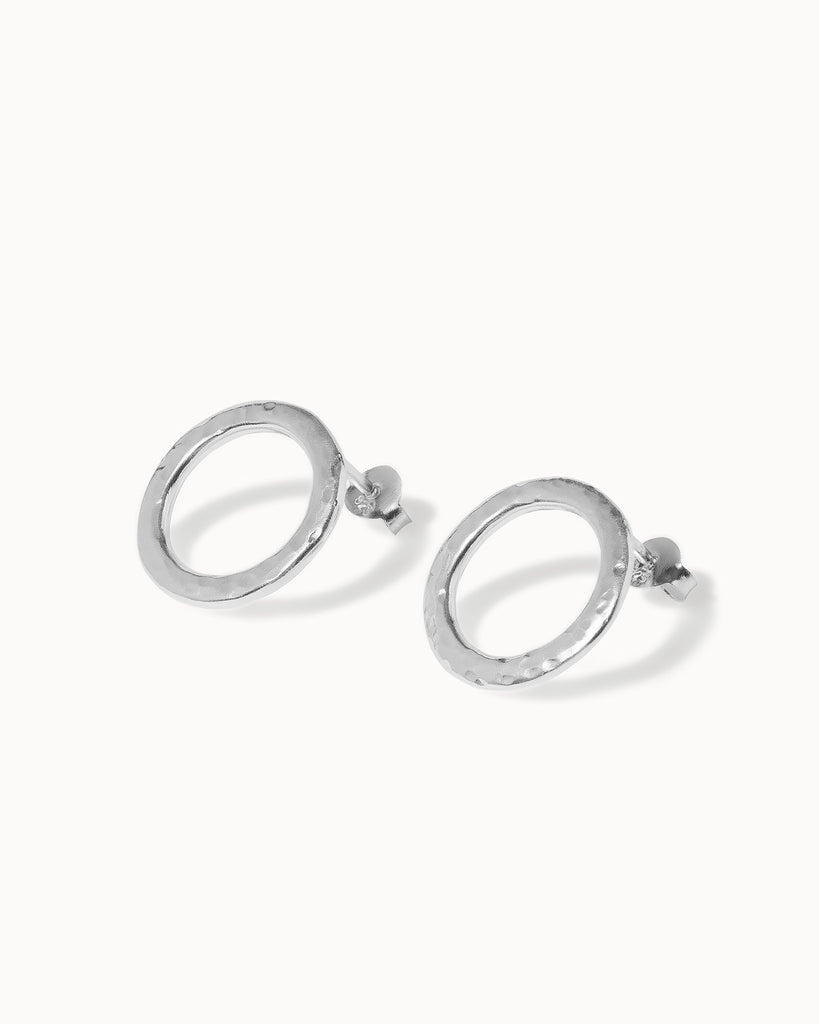 Statement sterling silver circular stud earrings with hammered texture handcrafted in London by Maya Magal London