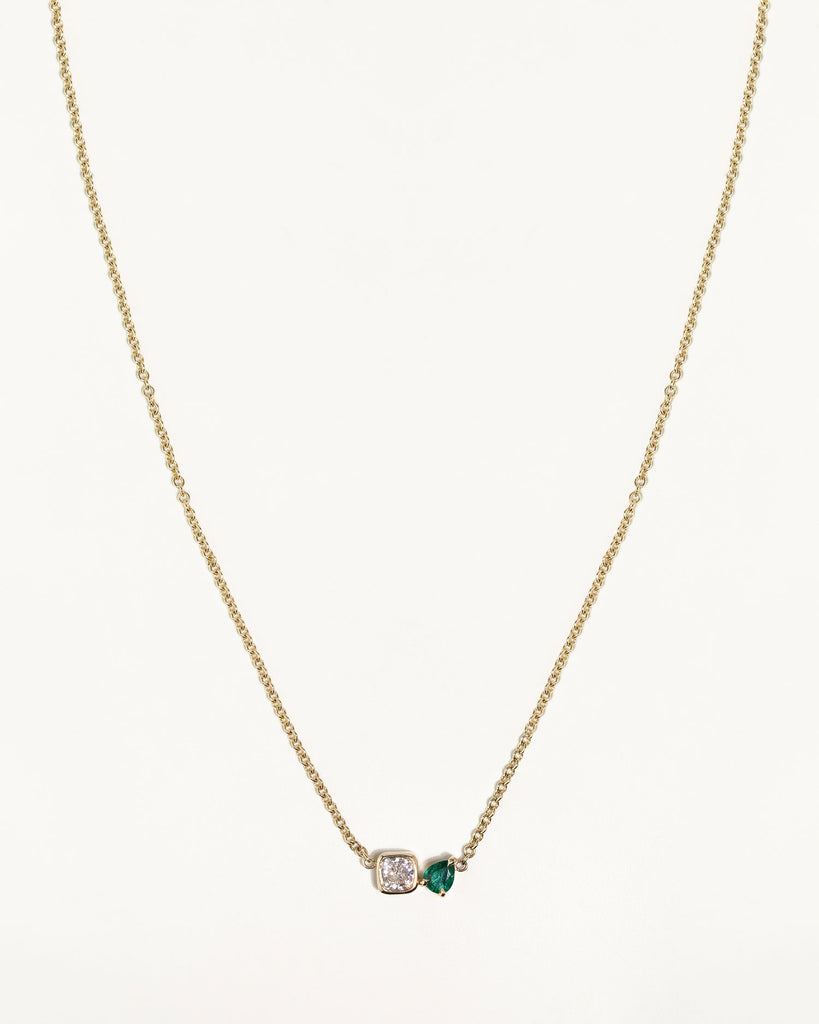 toi et moi necklace with 0.36ct lab grown diamond and pear cut emerald. Handcrafted in London by Maya Magal London