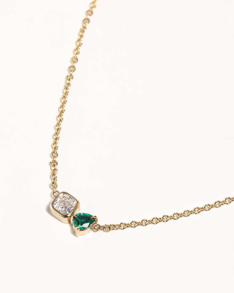 toi et moi necklace with 0.36ct lab grown diamond and pear cut emerald. Handcrafted in London by Maya Magal London