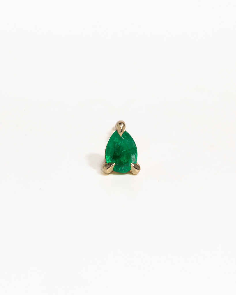 pear cut natural emerald stud earring encased in recycled solid gold handcrafted in London by Maya Magal London