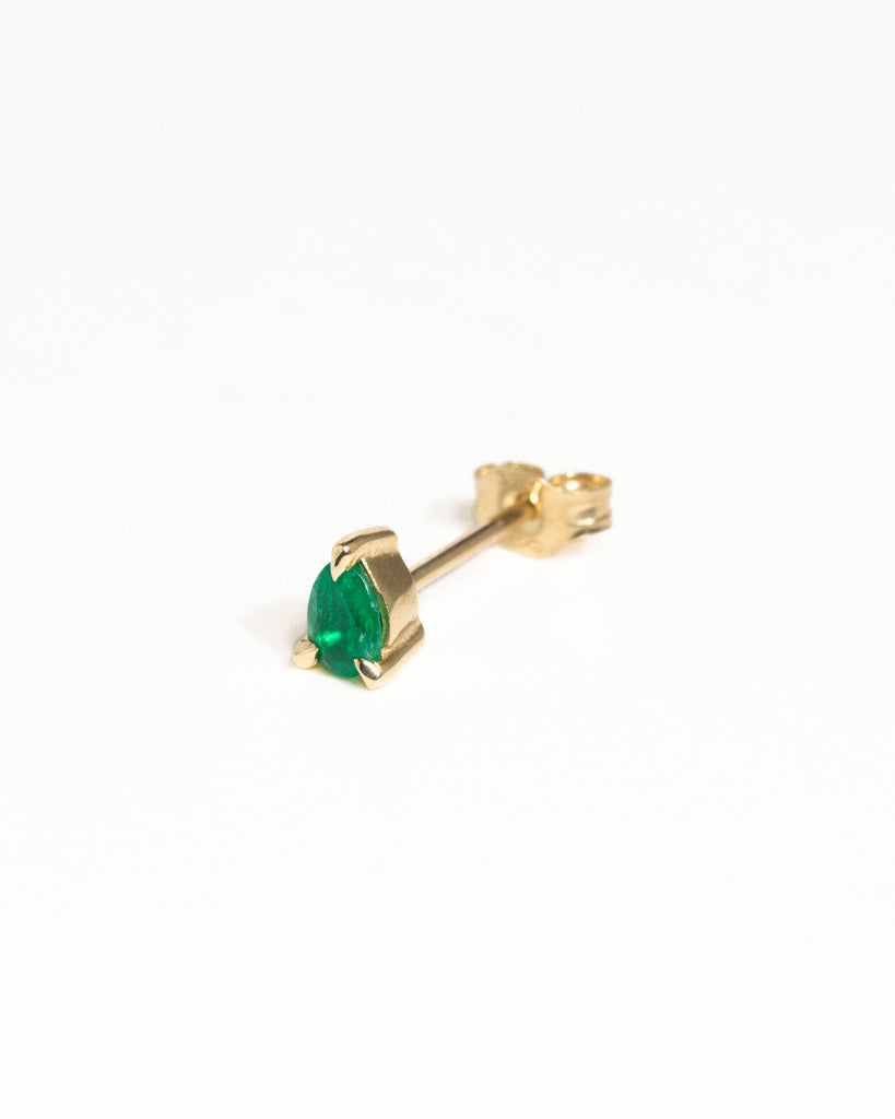 pear cut natural emerald stud earring encased in recycled solid gold handcrafted in London by Maya Magal London