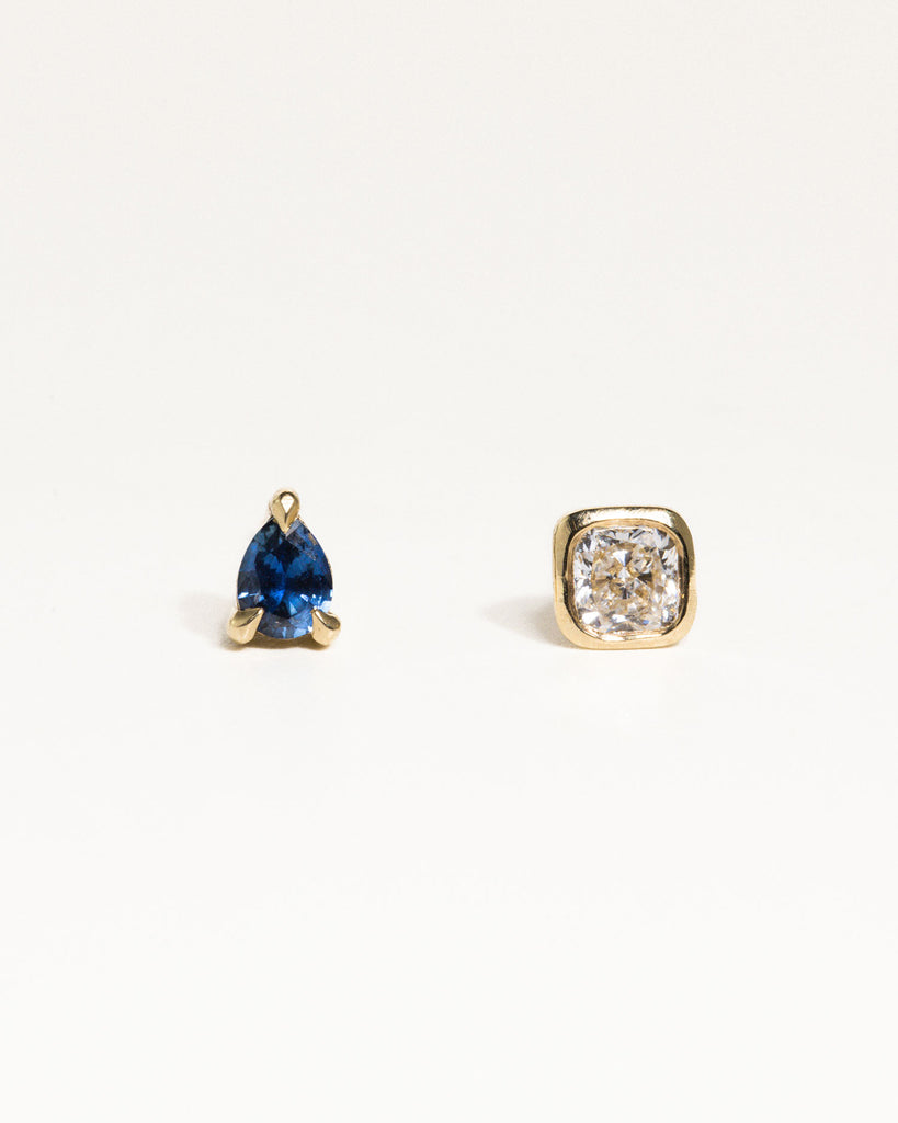 pear cut natural sapphire stud earring encased in recycled solid gold handcrafted in London by Maya Magal London