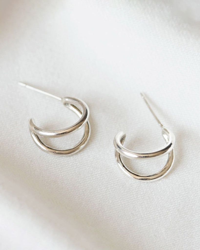 Recycled 925 sterling silver huggie hoop earrings handcrafted in London by Maya Magal London